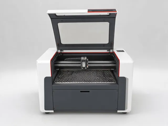 Enclosed CO2 engraving laser with a compact work bed